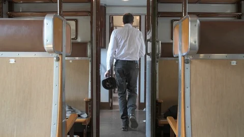 4K passenger rushing through the corridor of train in a hurry Stock Footage 90807764