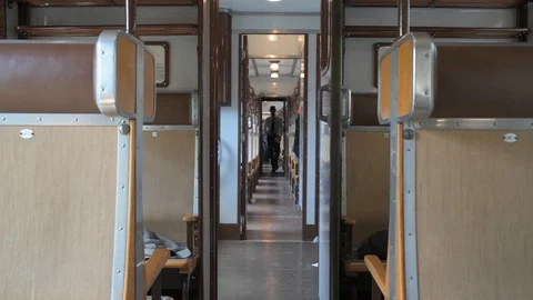 4K passenger rushing through the corridor of train in a hurry Stock Footage 90933603