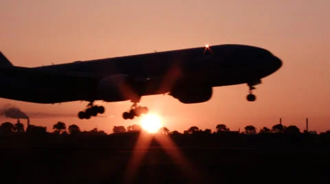4K Passing Airplane at sunrise Stock Footage 38846668