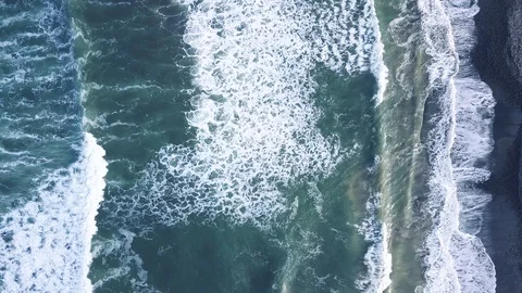 4K Patterns of foam forming on surface of ocean as waves are crashing Stock Footage 115507243