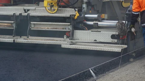 4K. Paver applying asphalt on the highway. Stock Footage 130193780