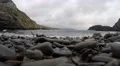 4K Pebble eye view of waves coming onto the rocky beach 4k or 4k+ Resolution