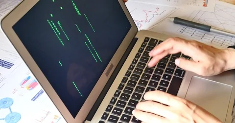 4k people operating computer,The Matrix style binary code on laptop. 库存影片 88984971
