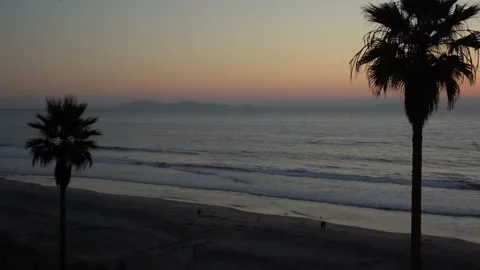 4K People Walking on Beach at Sunset with Coronado Islands in Distance Stock Footage 219660336