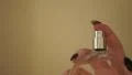 4K Perfume sprayed from clear bottle by womans hand 4k or 4k+ Resolution