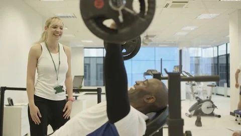 4K Personal trainer watching over clients, working out in modern gym Stock Footage 75848785