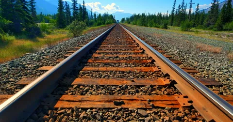 4K Perspective Shot of Railroad Train Track Steel Rails, Ties and Gravel Stock Footage 58143085