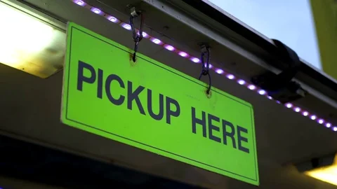 4K Pick Up Here Sign, Handing Business Sign Message at Food Truck Restaurant Video stock 80574247