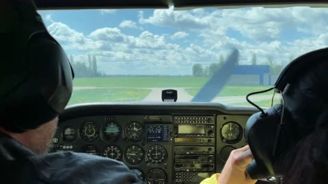 4k Pilots in a cockpit ready for flight. Pilot checking headphones before flying Video stock 154941519