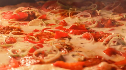 4K Pizza baking with pepper, leek and mozzarella in oven Video stock 44615506