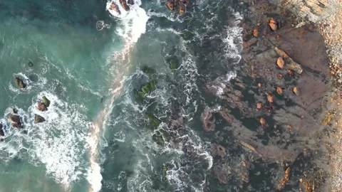 4K Plan view of Ocean water waves crashing into rocks Stock Footage 145448435