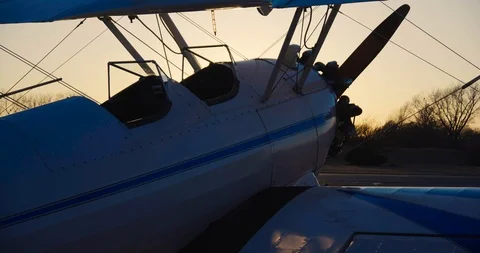 4K Plane on Runway during Sunset with Small Plane in Foreground Stock Footage 103212731