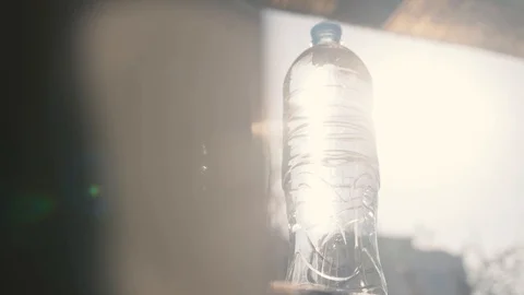 Small Water Plastic Bottle Rotates On Stock Footage Video (100