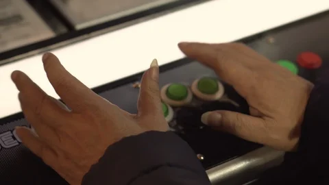 4K Playing Retro Arcade Machine Game And Pushing Controller Buttons Stock Footage 105176929
