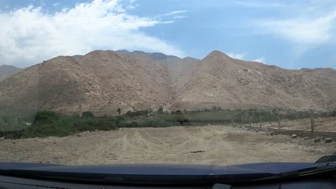 4k point of view of mountains and sky from inside a car Video stock 144353297
