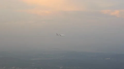 4k point of view pov shot airplane wing seeing another plane landing follow shot Stock Footage 64050718