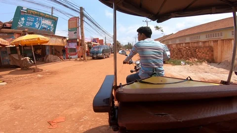 4k, point of view of tourist in local taxi through a dirt road of Siem Reap -Dan Stock Footage 119060254
