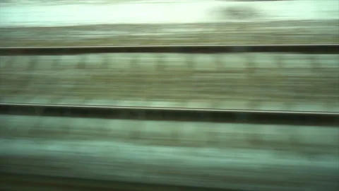 4K Point of view from the window of a passenger train. The rails moves outside Stock-Footage 99409946