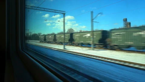 4K Point of view from the window of a passenger train. The deserted winter Stock Footage 99429107