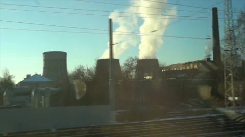 4K Point of view from the window of a passenger train. The nuclear power plant Video stock 99432583