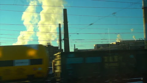 4K Point of view from the window of a passenger train. The nuclear power plant Stock Footage 99432765