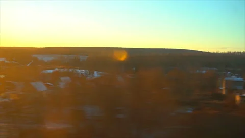 4K Point of view from the window of a passenger train. The deserted winter Stock Footage 99434630