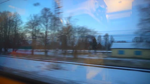 4K Point of view from the window of a passenger train. The deserted winter Stock-Footage 99435333