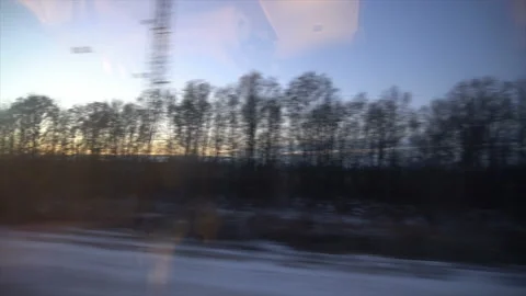 4K Point of view from the window of a passenger train. The deserted winter Stock Footage 99436126