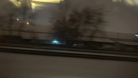 4K Point of view from the window of a passenger train. The deserted winter Stock Footage 99436368