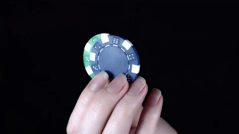 4k Poker Composition Two Chips in Hand Stock-Footage 71896307