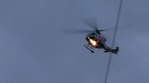 4K - Police helicopter flying above the viewer Stock Footage