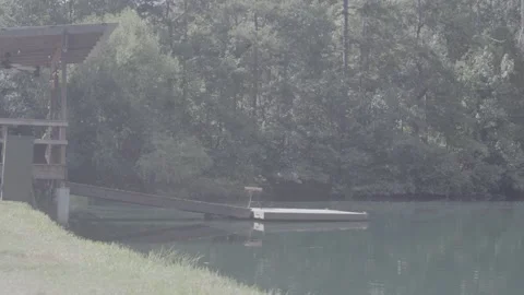 4K Pond with diving dock Stock Footage 171945378