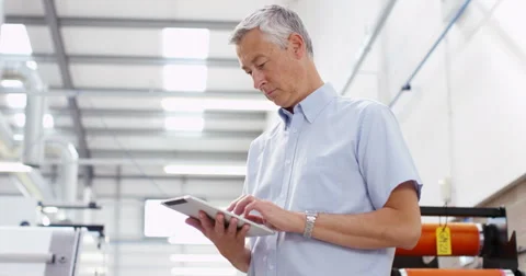4k, Portrait of a cheerful worker with a digital tablet in a warehouse Stock Footage 68853439
