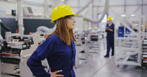 4K Portrait of confident female engineer smiling at camera with hands on hips Stock Footage 101961838