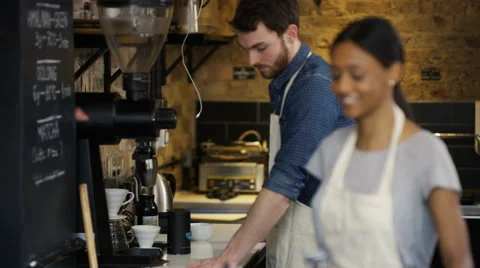 4K Portrait of friendly smiling worker standing behind counter in coffee shop Stock Footage 61839826