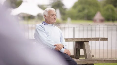 4K Portrait grumpy senior man sitting al... | Stock Video | Pond5