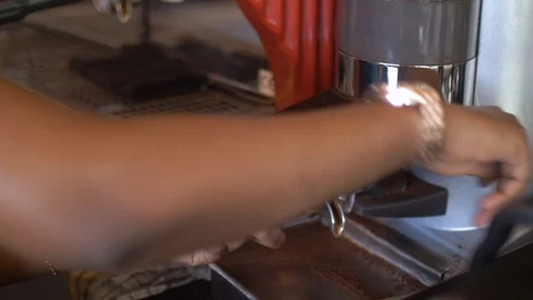 4K portrait of hands making espresso . Stockbeeldmateriaal 111340574