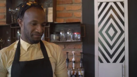 4K Portrait of handsome man serving customers in coffee shop. Stock Footage 111339821