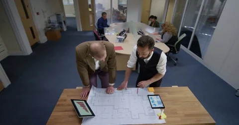 4K Portrait smiling architects or engineers working on a project together Stock Footage 76444334