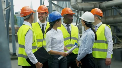 4K Portrait smiling multiracial team of engineers at industrial site Video stock 67432595