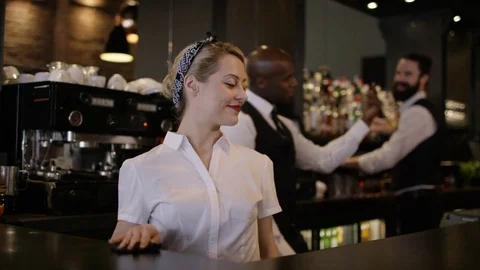 4K Portrait Of Smiling Team Of Bar Staff In Fashionable City Bar Stock Footage 75778089