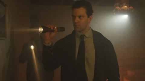 4K Portrait of tough guy cop investigating crime scene with his partner Stock Footage 66429244