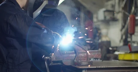 4K Portrait young apprentice welder &amp; senior colleague smiling at camera Video stock 111642142
