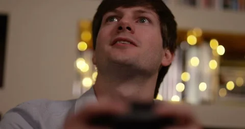 4k, Portrait of a young man playing video game after coming back home from work. Stock Footage 65689632