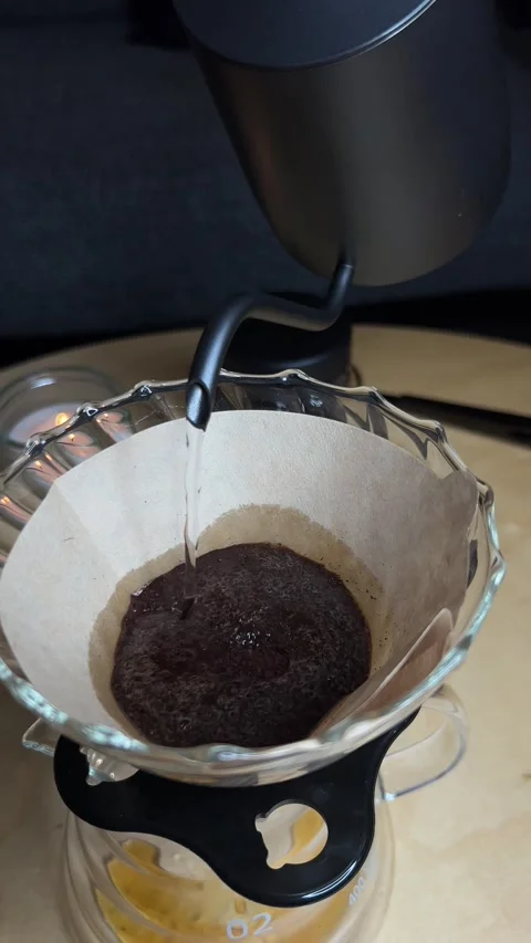 4K Pour-Over Coffee Brewing Process with Gooseneck Kettle and Glass Dripper Stock-Footage 297805030