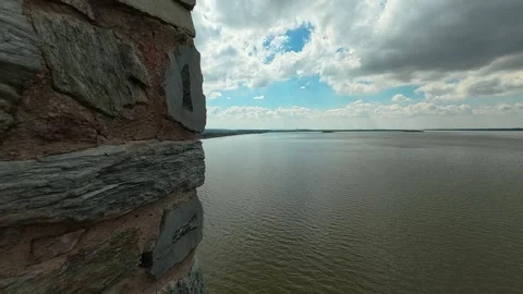 4K POV Leaning Through Medieval Arrow Slit to Reveal Majestic River and Valley Video stock 332543559