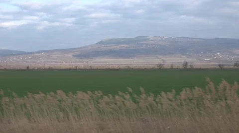 4K POV Point of view train pass fast speed green plain thatch wild landscape day Stock Footage 54717236