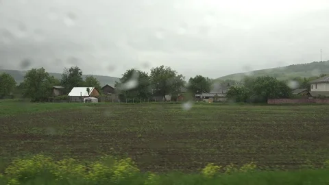 4K POV Point of view train pass village countryside in rainy day rain fall drop 動画素材 78783658