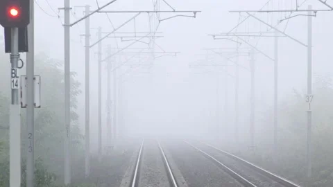 4K POV Point of view train pass modern infrastructure in foggy day, heavy fog Stock Footage 131141785