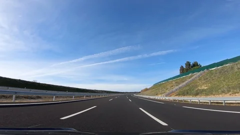 4K, POV view of car driving on highway in the provinces of Seville, Spain.-Dan Stock Footage 111890916